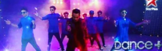 Dancers performing on a brightly lit Dance Plus stage.