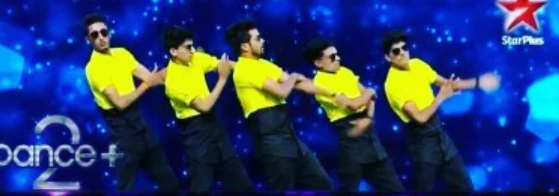 Crew in yellow shirts and sunglasses performing a synchronized dance.